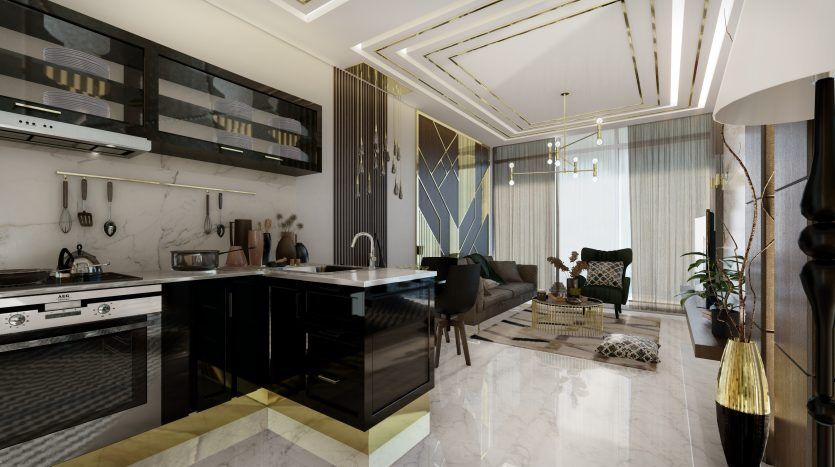 Cuisine et salon modernes avec armoires noires élégantes, sols en marbre blanc et touches dorées dans un appartement à Dubaï. L'espace présente des meubles élégants et des plantes décoratives, sous un plafond sophistiqué avec éclairage.