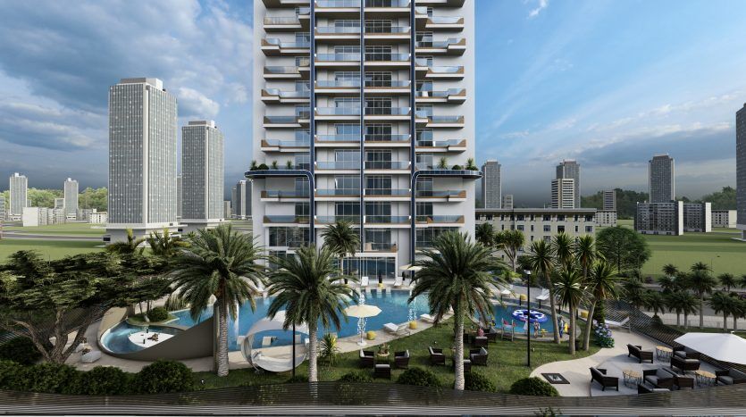 Immeuble de luxe de grande hauteur à Dubaï entouré de palmiers et d'une somptueuse piscine, avec d'autres gratte-ciel et un parc luxuriant en arrière-plan sous un ciel nuageux.