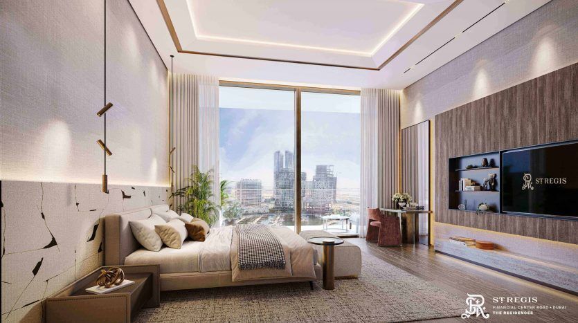 A modern, luxurious room in a Dubai apartment with a king-size bed, elegant decor, bay windows offering views of the cityscape and ambient lighting from a geometric pendant fixture.