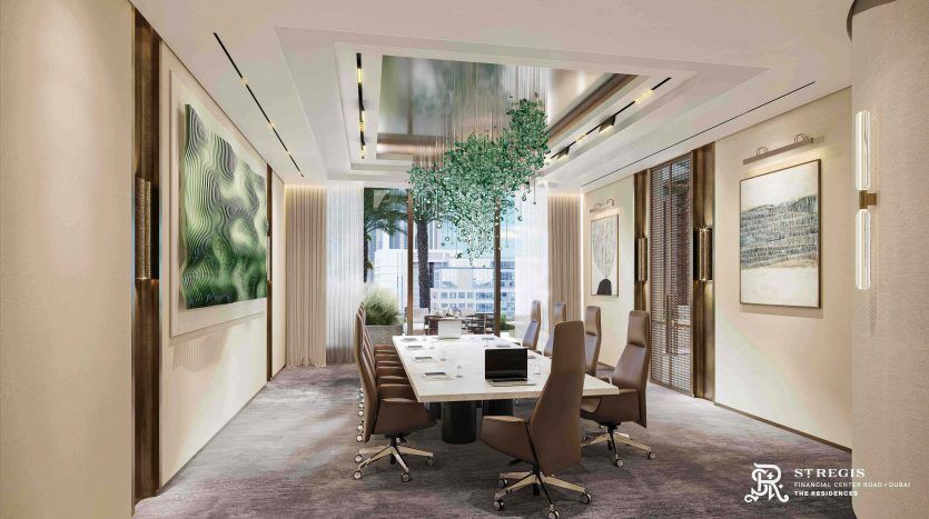 An elegant meeting room featuring a long table with chairs, surrounded by art and greenery, and large windows letting in natural light, located in a sophisticated villa in Dubai.