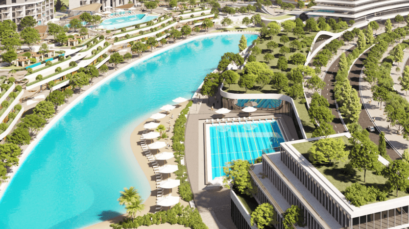 Aerial view of a luxury villa in Dubai featuring curved buildings surrounding an artificial blue lagoon and landscaped gardens, with relaxation areas and a rectangular swimming pool.