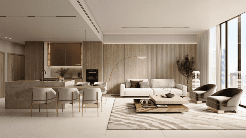 A modern, open-plan living/kitchen area, with light wood accents, a white sofa, two grey armchairs, a central marble island with four chairs, a coffee table, large windows and decorative plants. Natural light bathes the space.