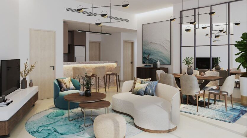 Salon et salle à manger modernes dans le Damac District de Dubaï, comprenant des canapés incurvés, des tables rondes, une télévision, une salle à manger, des tabourets de bar sur un comptoir de cuisine élégant, de grandes œuvres d'art murales, des miroirs, une plante d'intérieur et des luminaires contemporains.