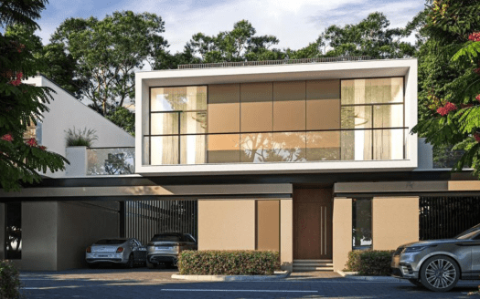 Villa moderne de deux étages à Dubaï avec de grandes fenêtres en verre, un toit plat et des voitures garées dans l'allée, entourée d'une verdure luxuriante et d'arbres en fleurs.