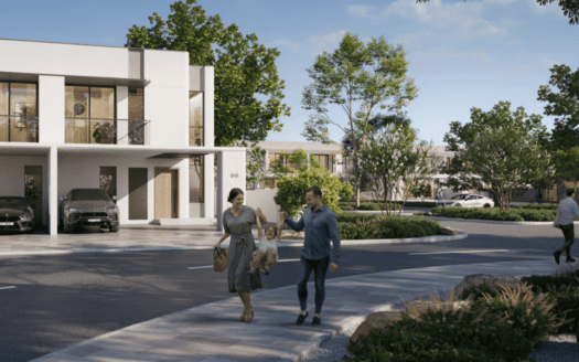 Un homme et une femme se promènent dans une rue bordée d'arbres dans un quartier résidentiel. Des maisons modernes avec de grandes fenêtres apportent une touche d'espace, tandis que deux voitures garées ajoutent une touche de vie quotidienne. La scène ensoleillée et sereine encadre la promenade tranquille d'Elea en arrière-plan.