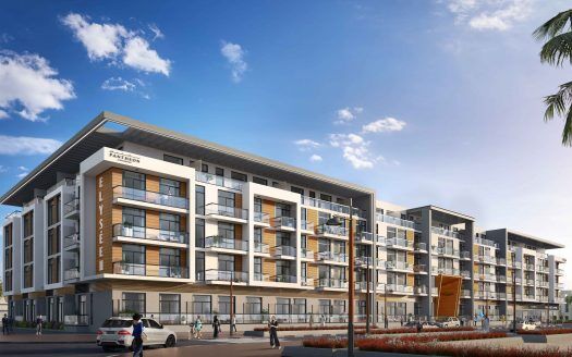 Immeuble d'appartements moderne au design épuré, doté de grandes fenêtres, de balcons et d'un mélange de façades blanches et brunes du Panthéon Elysée 3, sous un ciel bleu clair. Personnes