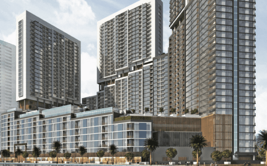 Immeubles modernes en bord de mer à The Crest Dubai avec des façades en verre réfléchissantes et des balcons donnant sur une rivière calme, entourés d'une verdure luxuriante et d'un ciel clair.