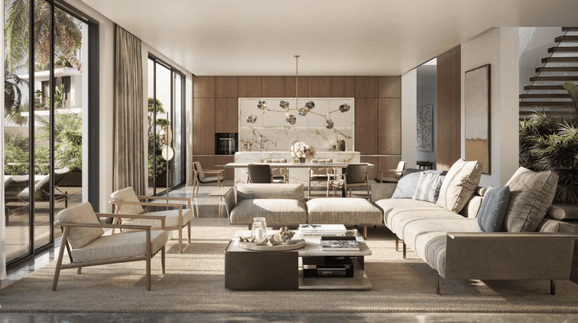 Spacious modern living room in a Dubai villa with elegant decor featuring a plush sectional sofa, elegant chairs, wood paneling and a view of the greenery outside through large sliding glass doors.