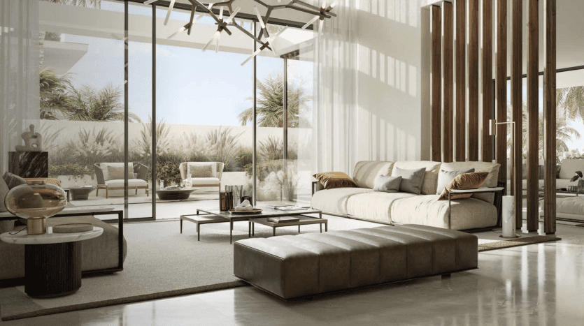 Modern living room in a Dubai villa featuring a large sectional sofa, wooden decorative elements, vast glass walls overlooking a serene landscape and elegant interior lighting.