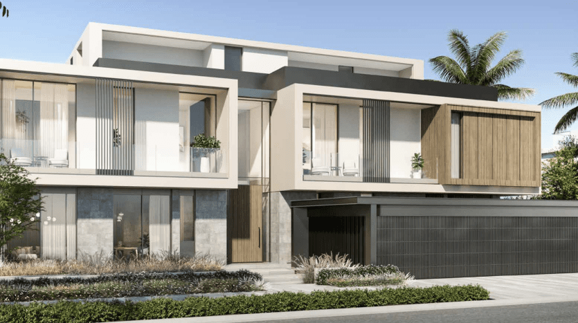 Modern two-storey villa in Dubai with large windows, wooden accents and garage, surrounded by lush greenery under a clear blue sky.