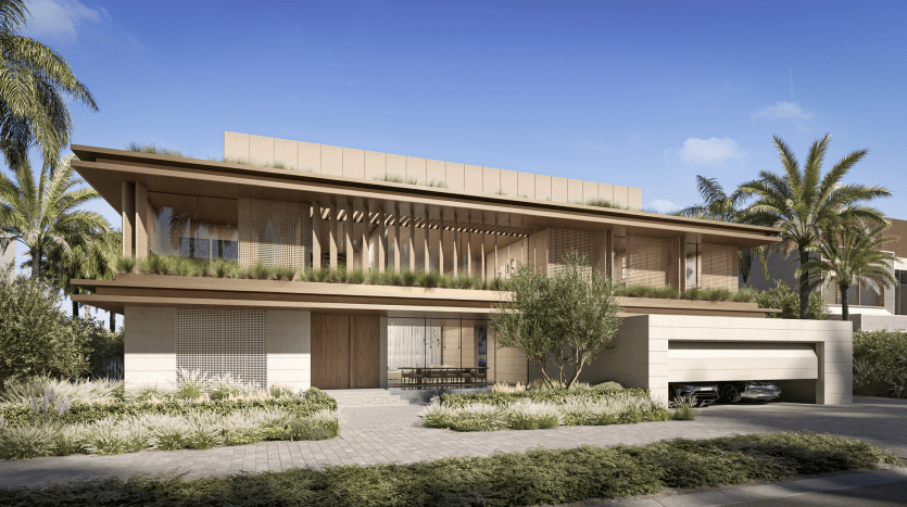 Modern two-story home featuring wood slat design elements, overhanging roofs with greenery and a driveway with a parked car, surrounded by palm trees and lush landscaping. Ideal for those looking for a