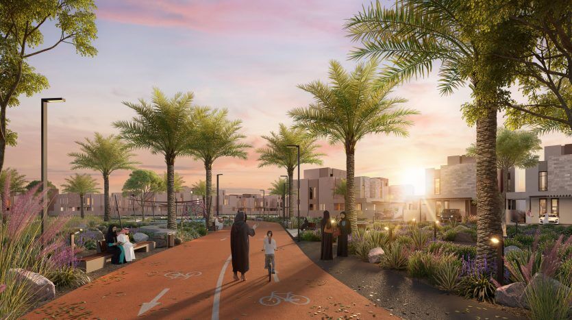 Une rue résidentielle paisible de Dubaï au coucher du soleil avec une femme en hijab marchant avec un enfant faisant du vélo, des gens assis sur des bancs, des palmiers, des maisons modernes et des fleurs colorées.