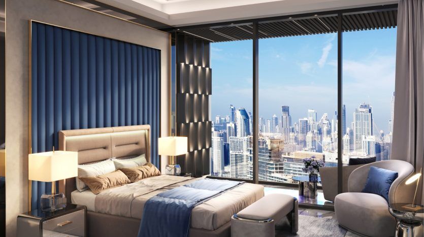 Luxurious bedroom interior in a Dubai apartment with a king-size bed, elegant furnishings and large windows offering panoramic views of the city's rooftops during the day.