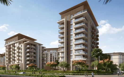 Rendu numérique d'immeubles d'appartements modernes à Dubaï avec des façades beiges entourées de palmiers sous un ciel bleu clair. Un chemin piétonnier soigneusement aménagé est visible au premier plan.
