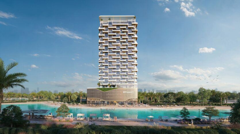 Le Caden est une grande tour moderne à la façade géométrique unique qui se dresse au bord d'un grand lagon turquoise, entouré de palmiers, de chaises longues et de jardins paysagers sous un ciel clair et lumineux.