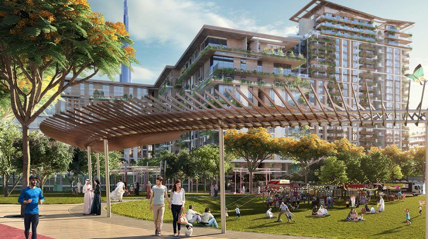 An architectural rendering of a futuristic multi-storey building surrounded by lush greenery, with people enjoying leisure activities in a lively central park, complete with modern walkways and clear skies.