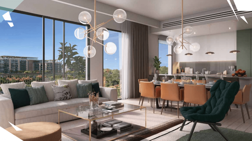 Modern living room with large windows opening onto a balcony overlooking Central Park. Features a plush green armchair, beige sofas, dining area and elegant pendant lighting.