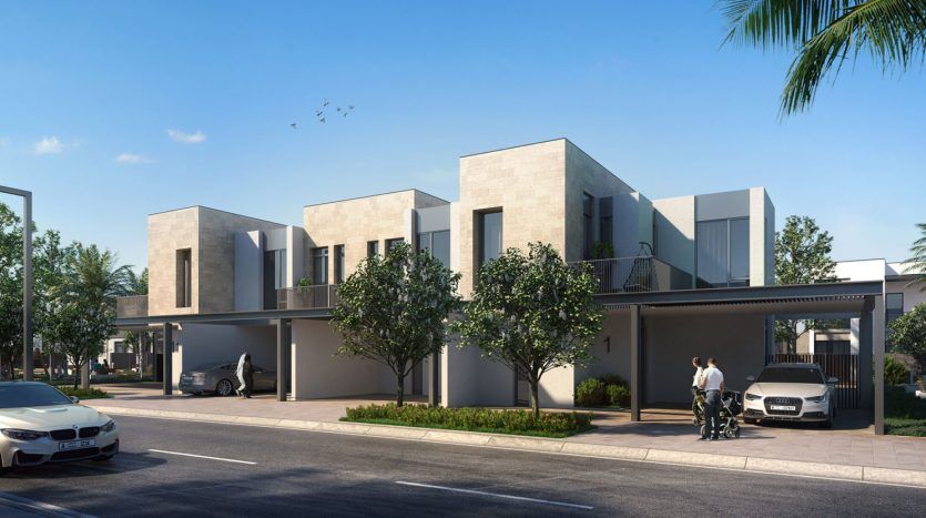 Maisons en rangée modernes dans Arabian Ranches 3 avec toits plats et design minimaliste, avec places de parking couvertes attenantes ; une vue sur la rue avec des voitures garées et une personne se promenant avec un landau.