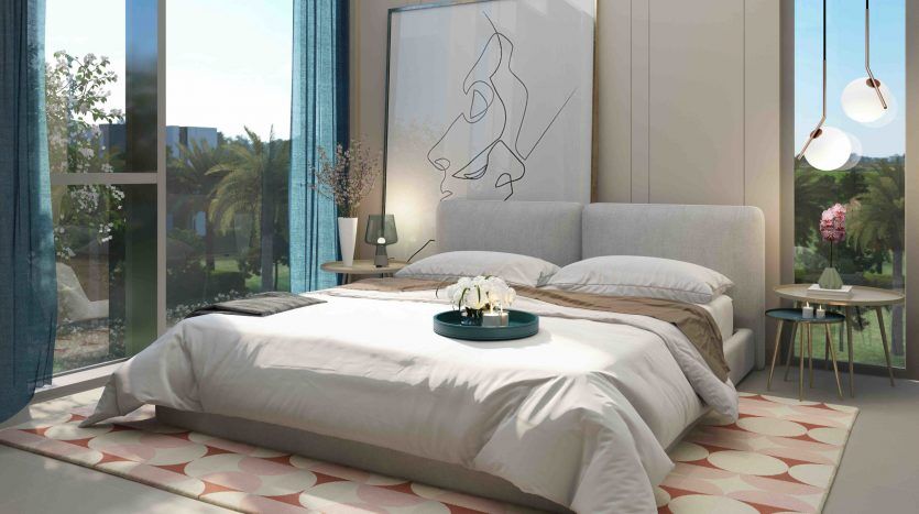 Une chambre moderne dans Arabian Ranches 3 avec un grand lit recouvert de draps blancs, des œuvres d'art abstraites sur les murs, de larges fenêtres offrant une vue sur le jardin et des lampes suspendues élégantes.
