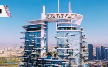 Vue aérienne de la tour moderne Roberto Cavalli à Dubaï, un immeuble de grande hauteur avec des façades en verre et des niveaux architecturaux uniques, situé sur les toits de la ville sous un ciel bleu clair.