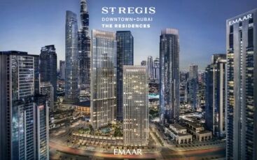 Une image promotionnelle mettant en vedette les résidences Emaar Downtown Dubai. Un paysage urbain animé avec des gratte-ciel et des rues illuminées au crépuscule. Le logo Emaar est visible.