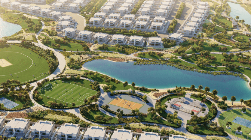 Vue aérienne d'un quartier résidentiel luxueux de Dubaï avec des maisons parfaitement alignées, des espaces verts luxuriants, un grand lac central, des courts de tennis et un parcours de golf, présentant un agencement suburbain parfait.