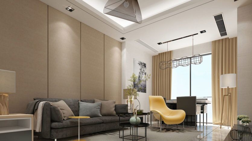 Salon moderne comprenant un canapé gris, un fauteuil jaune et un élégant bureau noir sous un élégant luminaire suspendu près de la tour carrée, avec des murs aux tons neutres et des plantes décoratives.