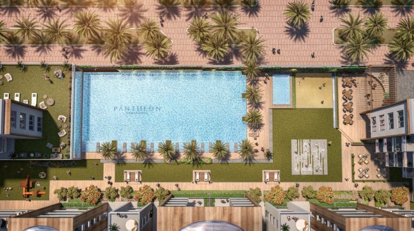 Vue aérienne d'un complexe de luxe doté d'une grande piscine labellisée "Panthéon Elysée", entourée de palmiers, de chaises longues et de sections de jardins et d'allées bien entretenus.