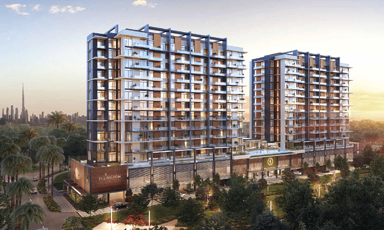 Immeubles d'appartements de luxe au crépuscule avec balcons éclairés, entourés d'une verdure luxuriante et d'un horizon clair en arrière-plan. Un panneau indique "Wilton Park".