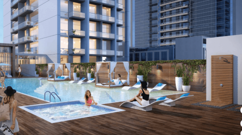 Espace piscine luxueux sur le toit d'un immeuble d'appartements moderne à Dubaï, où les résidents se détendent sur des chaises longues et des cabanes élégantes, entourés d'une architecture contemporaine.