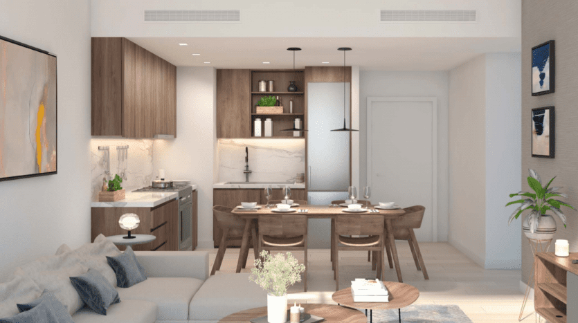 Intérieur d'appartement moderne à Dubaï comprenant un aménagement ouvert avec une cuisine présentant un dosseret en marbre blanc et des armoires en bois, un coin repas avec une table ronde et des chaises, et un espace de vie confortable avec un canapé et