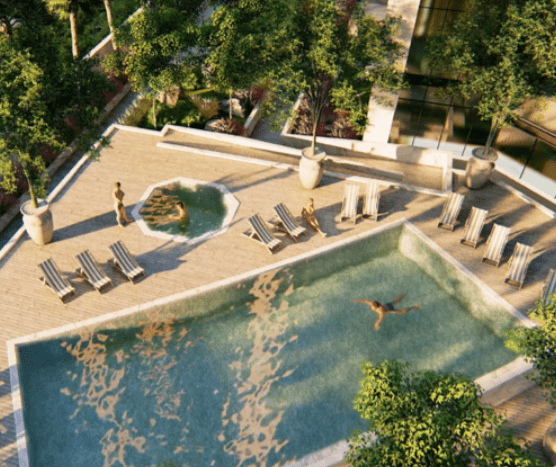 Vue aérienne d'une luxueuse piscine extérieure de la Nobles Tower avec des chaises longues, des jardins paysagers et des personnes bénéficiant des commodités.