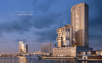 Une vue panoramique en soirée sur le 15e quartier du front de mer du côté nord, avec des immeubles modernes de grande hauteur, avec un éclairage proéminent et une voie navigable calme reflétant les lumières de la ville.