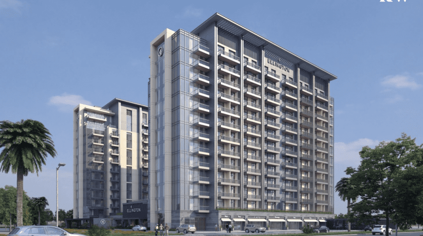 Rendu numérique d'un complexe résidentiel moderne à Kensington avec plusieurs immeubles de grande hauteur, un environnement paysager et un ciel dégagé. L'extérieur dispose de balcons et de grandes fenêtres. Logos présents sur le bâtiment.