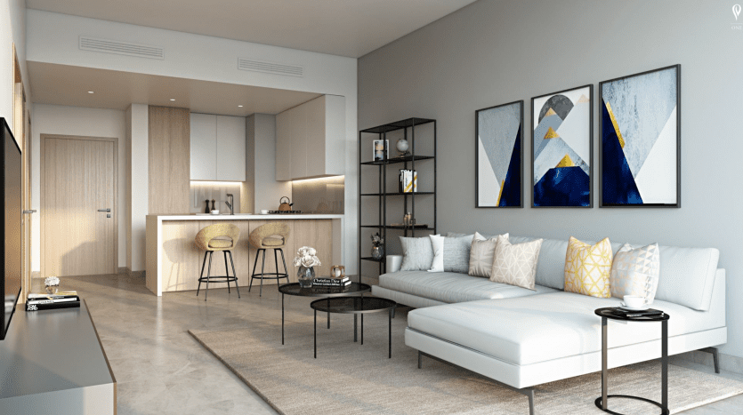Salon moderne avec un canapé blanc en forme de L, des œuvres d'art géométriques au mur, une table basse en verre et une cuisine ouverte avec des tabourets de bar en arrière-plan, conçu par Peninsula Select Group Dubai.