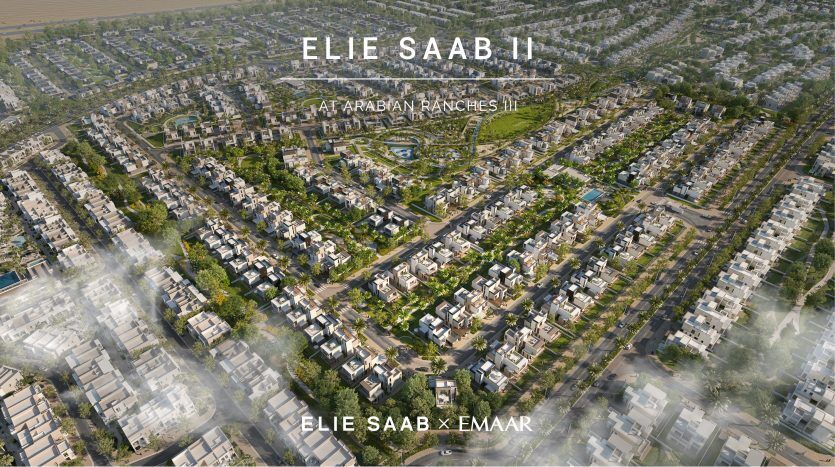 Vue aérienne d'un quartier résidentiel avec des maisons uniformes et serrées, étiquetées « Elie Saab at Arabian Ranches » et « Elie Saab x Emaar » en bas.