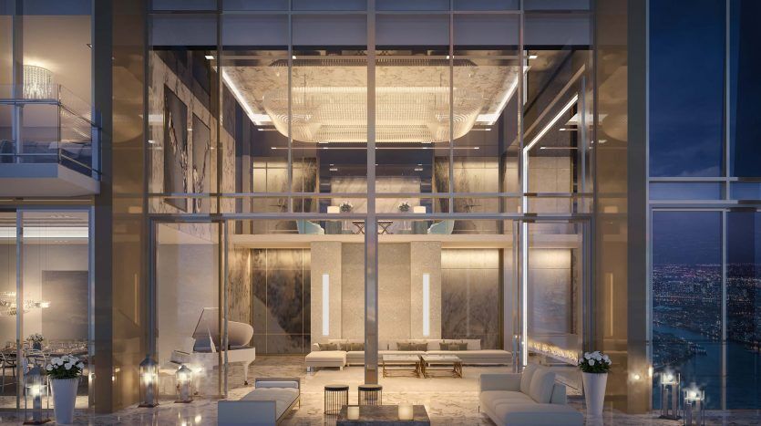 Intérieur luxueux d'un penthouse de deux étages la nuit au Sterling Dubai, doté de grandes fenêtres donnant sur un paysage urbain, d'un mobilier élégant, d'un éclairage et d'un décor calme et sophistiqué.