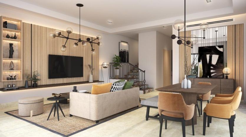 Salon moderne dans une villa de Dubaï avec un canapé moelleux, des oreillers à motifs et une télévision à écran plat, se fondant dans un coin repas doté de chaises élégantes et de suspensions. Les tons neutres et les accents de bois créent