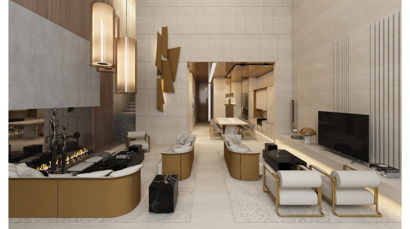 Salon luxueux et moderne dans un appartement de Dubaï au design élégant, avec des accents dorés, des sièges moelleux, une cheminée et une grande télévision, le tout dans un espace spacieux avec un éclairage naturel.
