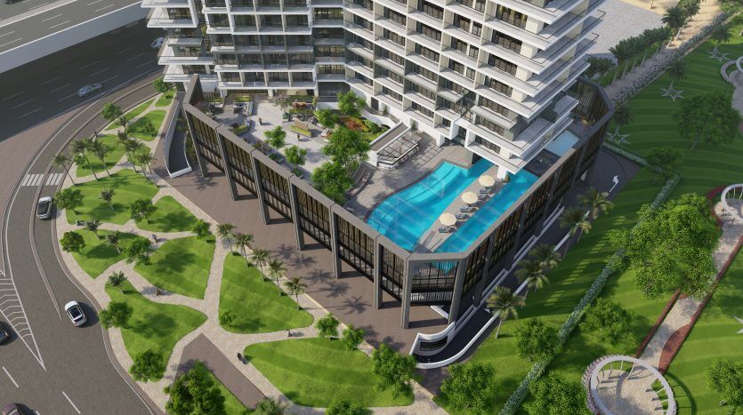 Vue aérienne d'une villa moderne à Dubaï avec piscine, entourée d'un aménagement paysager verdoyant et de routes adjacentes.