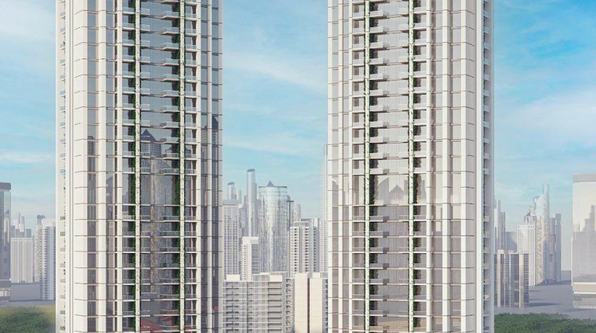 Deux gratte-ciel hauts et élégants avec des façades en verre réfléchissantes se tenant côte à côte sous un ciel bleu clair, entourés d'arbres verts et d'un horizon de la ville en arrière-plan, présentant les principales opportunités d'investissement à Dubaï.