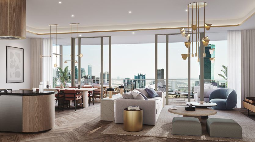 Salon moderne avec un mobilier élégant et de grandes fenêtres donnant sur un paysage urbain de Dubaï. La chambre dispose d'un coin salon confortable, d'une kitchenette élégante et d'une décoration élégante.