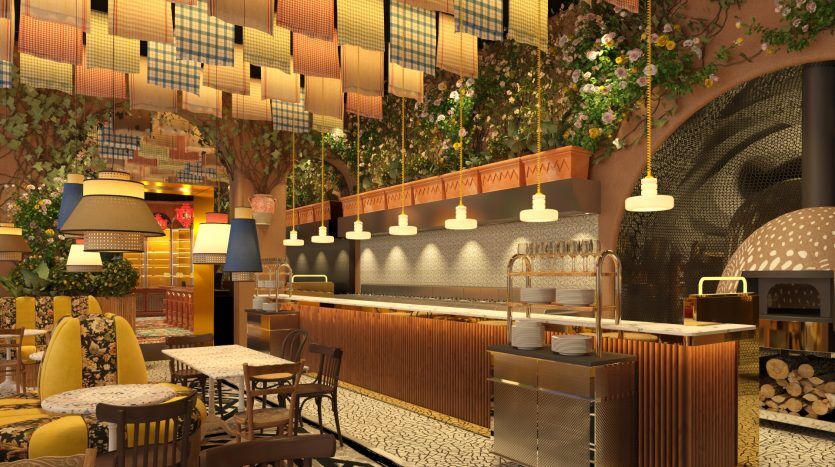 Un intérieur de café confortable et élégant avec un éclairage ambiant chaleureux, situé à Dubaï, comprenant un comptoir de bar en bois, des carreaux de sol à motifs, des décorations florales, des lampes suspendues et divers agencements de sièges.