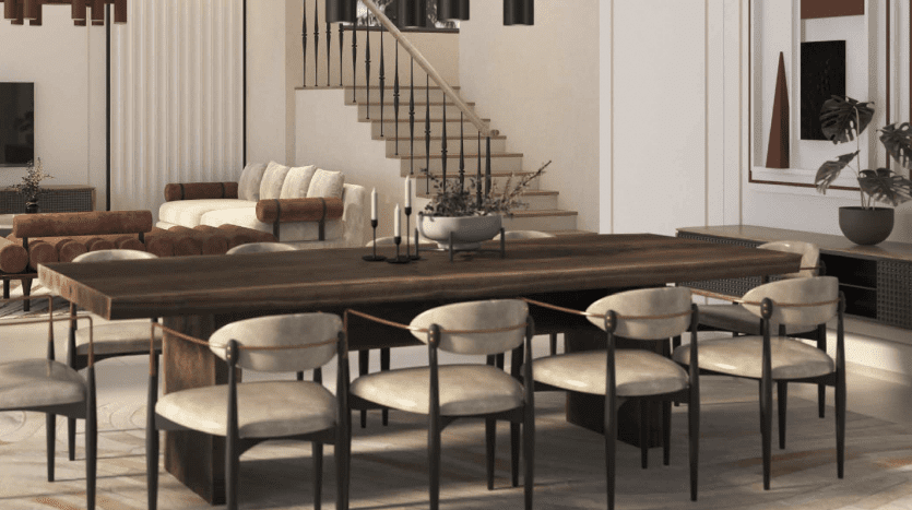 Une salle à manger spacieuse et moderne dans une villa de Dubaï comprenant une longue table en bois sombre entourée de chaises beiges moelleuses, avec un élégant escalier en colimaçon en arrière-plan et des plantes d'intérieur ajoutant une touche de verdure