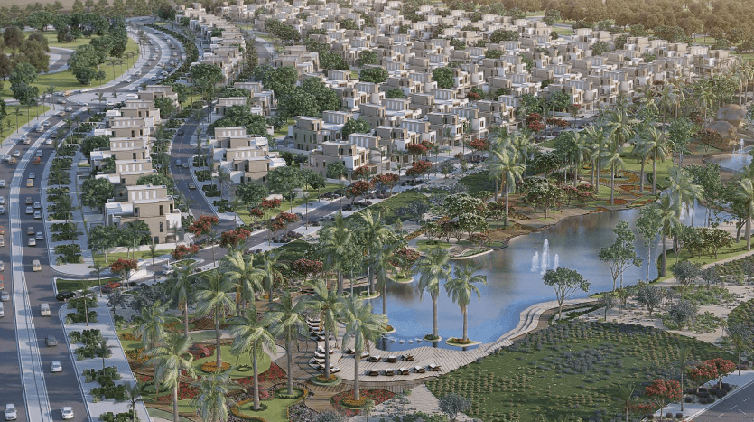 Vue aérienne d'un quartier résidentiel planifié avec des villas blanches uniformes disposées en rangées courbes, entourées d'une verdure luxuriante, de palmiers et d'un lac central avec un coin salon.