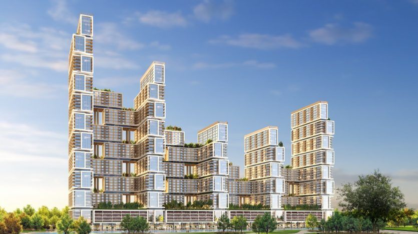 Bâtiments résidentiels futuristes à plusieurs niveaux dans un parc luxuriant avec un ciel clair à Dubaï. L'architecture présente un design cubiste empilé avec des balcons et des terrasses vertes.