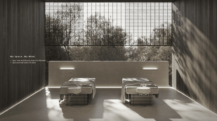 Intérieur minimaliste comprenant deux lits bas avec des draps blancs dans une villa ensoleillée à Dubaï, de grandes fenêtres donnant sur des arbres verts et des murs texturés.