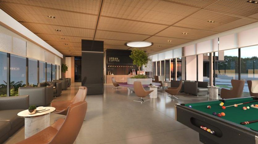 Intérieur de café moderne au décor élégant, comprenant une table de billard, diverses options de sièges, de grandes fenêtres et un comptoir étiqueté « café urbain ». La lumière naturelle remplit l'espace, le rendant semblable au luxe
