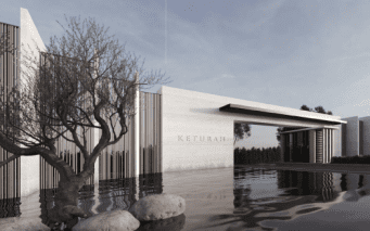 Conception architecturale moderne avec un bâtiment portant le nom « Keturah » sur sa façade, entouré d'eau, d'arbres dénudés et de grosses pierres, reflétant une esthétique tranquille et élégante dans une villa de premier ordre à Dubaï.