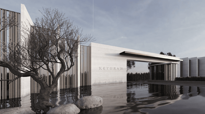 Conception architecturale moderne avec un bâtiment portant le nom « Keturah » sur sa façade, entouré d'eau, d'arbres dénudés et de grosses pierres, reflétant une esthétique tranquille et élégante dans une villa de premier ordre à Dubaï.